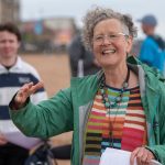 A woman leading singing